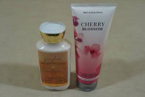 lot 135 image: 2 Bottles Bath & Body Works Lotion -Heart of Gold, Cherry Blossom