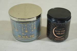 lot 143 image: 2 Bath & Body Works Candles -Black Tie, Into the Night