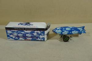 lot 176 image: Stealth Zeppelin Wind-Up Tin Toy