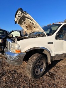 lot 2 image: 1999 Ford F250 Super Duty Crew Cab Pick Up with Topper