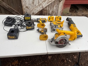lot 6 image: DeWalt Tool 18V Set Includes DC983 Heavy Duty Cordless Drill, DC825 14 Cordless Impact Driver, DC385 Variable Speed Reciprocating Saw,DW936 5 38 Trim Saw, DC330 Cordless Variable Speed Jigsaw, & Two DeWalt 18V to 20V Adaptors   - No Batteries