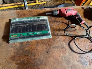 lot 82 image: Corded 38 Variable Speed Reversible Drill and Spade Drill Bit Set