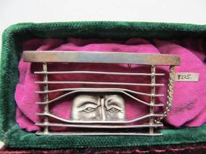 lot 29 image: Very Cool Sculptural Sterling Brooch Pin wFace Looking Through Window