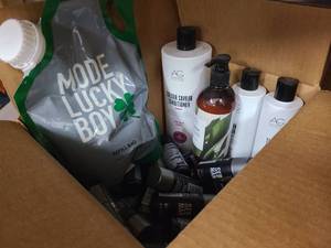 Box of new hair care supplies from name brand retailers