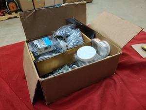 Box of new or partially used hardware for home or shop use