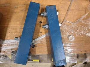 2 Heavy gauge steel beams with 4 solid bolts fastened to them. Extra heavy