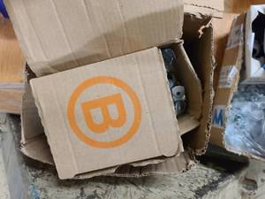 Box of new or partially used hardware for home or shop use