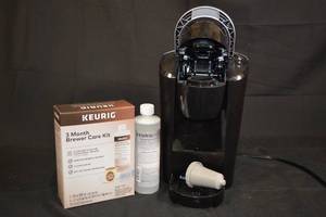 lot 42 image: Keurig Coffee Maker with Maintenence Supplies