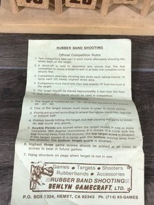 lot 76 image: Rubber Band Shooting Game with Game Rules