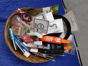 lot 180 image: Basket of new make-up and hair accessories