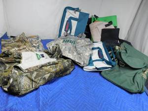 lot 187 image: Camouflage pants, bib overalls, duffle bags, tool bags and tote bags