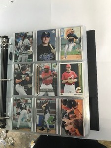 lot 384 image: Lot of 700 Plus Baseball and Football Cards in Binder