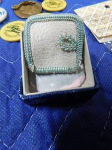 lot 234 image: Advertisement pins tokens, scelluloid jewel box, powder box, and more