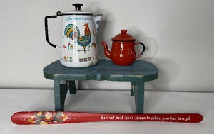 lot 85 image: Berggren Antique Enamelware coffee pot, enamel mini teapot, bench, lefse stick painted