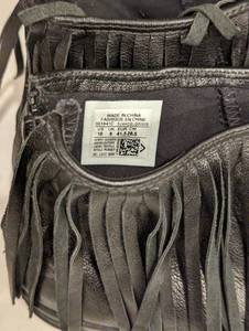 lot 119 image: Converse Black Leather Fringe Sneakers