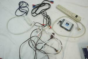 lot 147 image: Power strip and electronic cords plus Linksys server