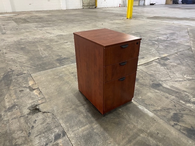 Wooded Laminate file cabinet on wheels.