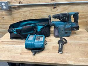 lot 47 image: MAKITA Cordless Hammer Drill with HEPA Filter, Battery, Charger and Bag