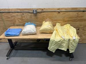lot 70 image: Lot of Hospital Gowns and Bed Liners