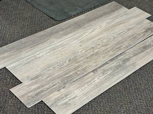 lot 704 image: Lot of (14 Boxes) Click-Snap Floating 100% Waterproof Luxury Plank Flooring by United Surface Solutions 28.84-sq.ft.  Total Coverage 403.76-sq.ft.