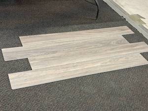 lot 710 image: Lot of (16 Boxes) Tyler Freedom Click-Snap Floating 100% Waterproof Luxury Plank Flooring by United Surface Solutions HFUS39 28.84-sq.ft.  Total Coverage 461.44-sq.ft.