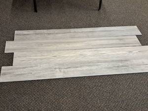 lot 715 image: Lot of (19 Boxes) Click-Snap Floating 100% Waterproof Luxury Plank Flooring by United Surface Solutions 28.84-sq.ft.  Total Coverage 547.96-sq.ft.
