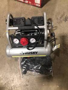 lot 46 image: Husky 1 Gal. Portable Electric-Powered Silent Air Compressor  Customer Returns See Pictures