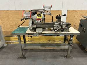 lot 12 image: LATHE Mounted on Steel Workbench Model CL667A