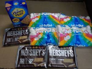 lot 145 image: 1 Box Honey Maid Graham Crackers, 4 bags Jet Puffed Marshmallows and 3 - 6 packs Full Size Candy Bars