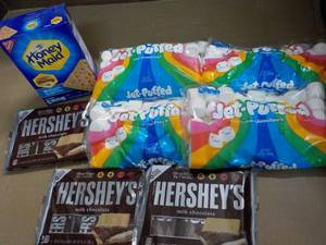 lot 148 image: 1 Box Honey Maid Graham Crackers, 4 bags Jet Puffed Marshmallows and 3 - 6 packs Full Size Candy Bars
