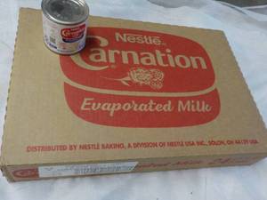 lot 151 image: 24 ct 5 oz Cans Nestles Carnation Evaporated Milk - best date 08312023