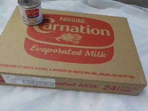 lot 152 image: 24 ct 5 oz Cans Nestles Carnation Evaporated Milk - best date 08312023