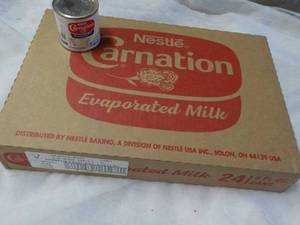 lot 154 image: 24 ct 5 oz Cans Nestles Carnation Evaporated Milk - best date 08312023