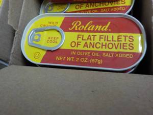 lot 196 image: 100 - 2 oz Tins Roland Flat Anchovy Fillets in Olive Oil Best by 08072023