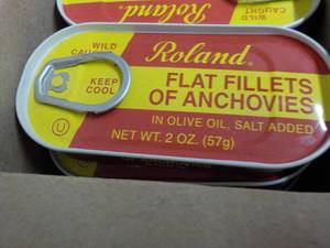 lot 197 image: 100 - 2 oz Tins Roland Flat Anchovy Fillets in Olive Oil Best by 08072023