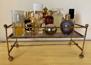 lot 136A image: Beautiful Brass Colored Tabletop Shelf, Vanity Holder with a Variety of Wonderful Perfume