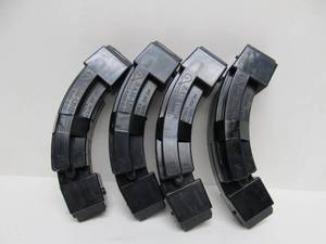 lot 41 image: Lot of 8 Matching RAM-LINE 1022 .22 Caliber Banana ClipsMagazines - 25 Rounds - Also Fits Ruger