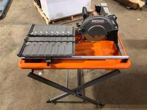 lot 50 image: RIDGID 9-Amp 7 in. Blade Corded Wet Tile Saw with Stand  Customer Returns See Pictures