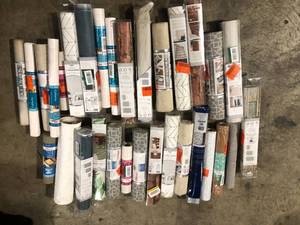 lot 49 image: Lot of Assorted Peel and Stick Wallpaper Various Sizes, Styles and Conditions  Customer Returns See Pictures