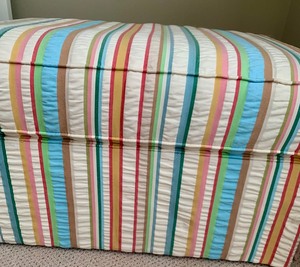 lot 27 image: Colorful Striped Upholstered Ottoman