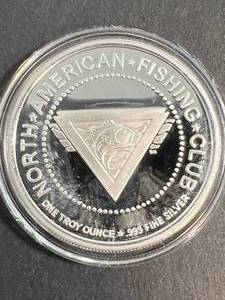 1 TROY OZ .999 FINE SILVER NORTH AMERICAN FISHING CLUB ROUND IN AIRTITE