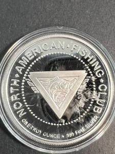 1 TROY OZ .999 FINE SILVER NORTH AMERICAN FISHING CLUB ROUND IN AIRTITE