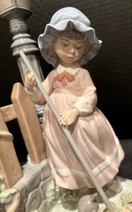 lot 149 image: Retired Fall Clean Up Figurine by Lladro