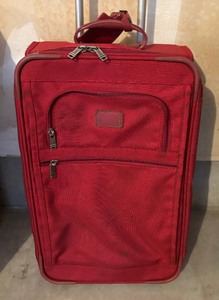 lot 196 image: Two Red Tumi Rolling Suitcases