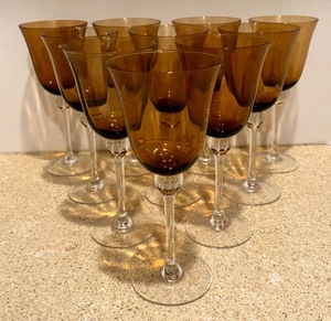 lot 249 image: Ten Amber Colored Goblets with Clear Stems