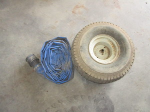 lot 153 image: Water Pump Hose & Lawnmower Wheel & Tire