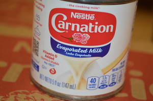 lot 317 image: Case of Nestle Carnation Evaporated Milk 24 5oz Cans Best By08312023 