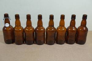 lot 162 image: 8 Vintage Grolsch Amber Brown Beer Bottles