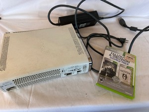 lot 55 image: Xbox 360 (2008) with Power Supply Turns on, DVD Tray Stuck Includes Fallout and Borderlands 2 Xbox 360 Game