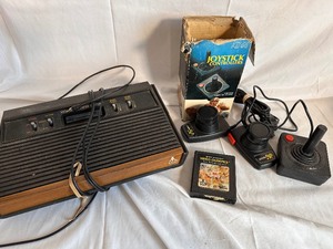 lot 62 image: Atari Computer Gaming System with 1 Joystick Controller, Video Olympics Game and Paddle Controllers - Not Tested